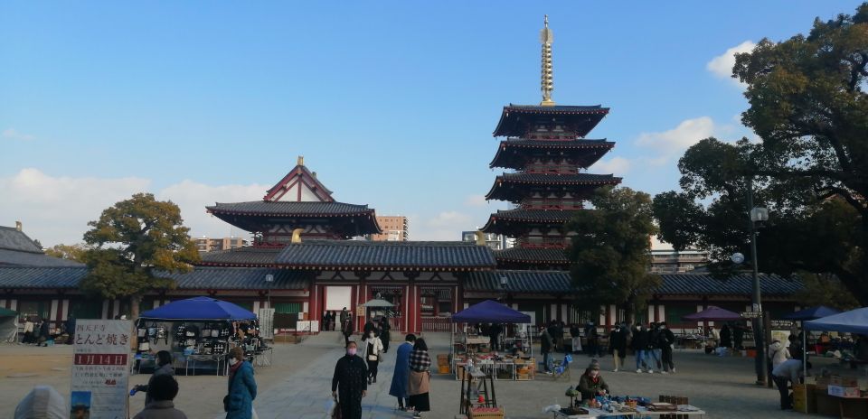 Osaka: Five Must-See Highlights Walking Tour & Ramen Lunch - Dotonbori: Running-Man Photo Spot and the Neon-To-Quiet Shift
