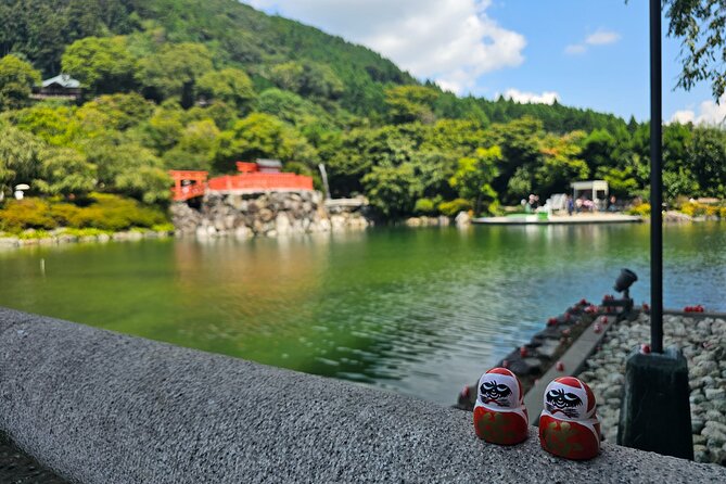 Osaka Half-day E-bike Adventure: Minoh Falls & Katsuoji Temple - Katsuoji Temple: daruma dolls, mountain-road riding, and big Osaka views