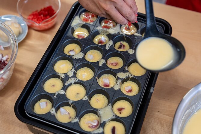 Osaka Home Feast Cooking and Sake Experience - The cooking studio setup: aprons, teamwork, and a pace that stays fun