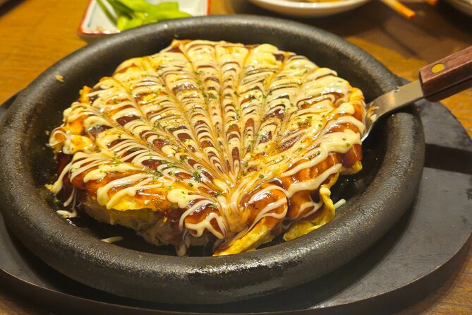 Osaka: Shinsekai Food Tour - 13 Dishes at 5 Local Eateries - Shinsekai streets: retro neon, arcades, and real local energy