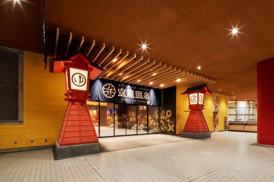 Osaka: Solaniwa Onsen Hot Spring Visit - Entering the rooftop Tenku Garden with torii gates and waterfalls